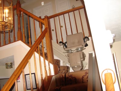 Stair lift on staircase in an assisted living facility.