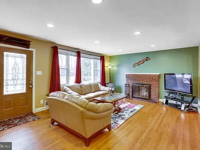 Cozy living room with a fireplace and seating area.