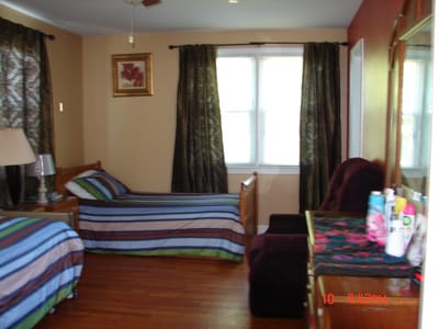 Cozy resident room with two beds and decor