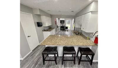 Modern kitchen interior with bar stools