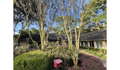 Exterior view of the facility with landscaped garden