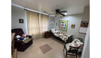 Cozy resident room with a bed and seating