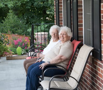 Two residents enjoying the porch area.