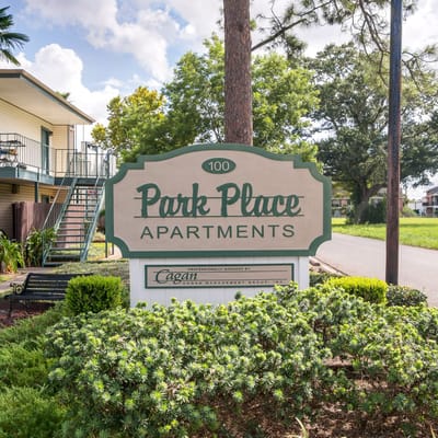 Sign for Park Place Apartments with greenery