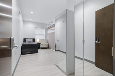 Interior view of a private resident room with minimal furnishings