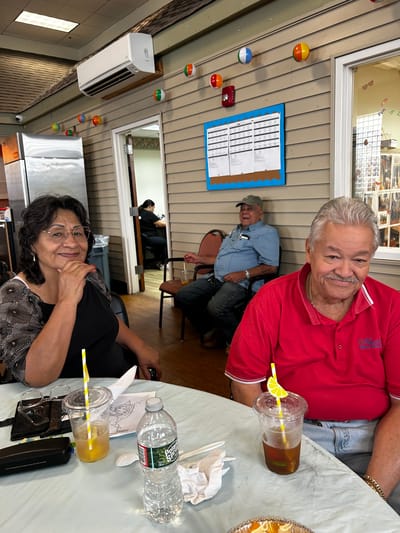 Residents enjoying refreshments in a common area