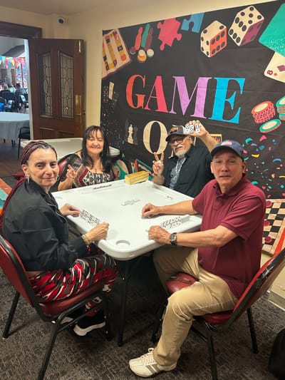 Residents playing a game in a common area