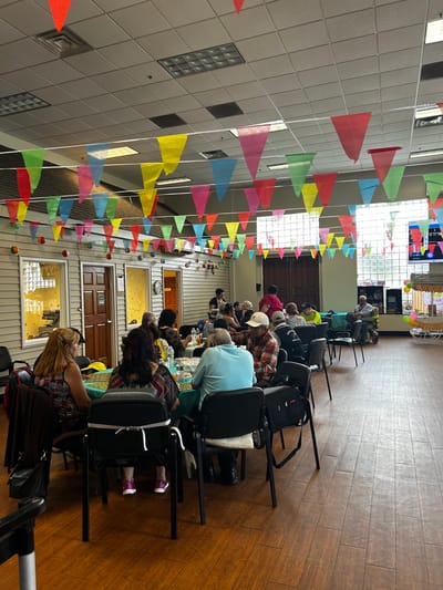 Residents engaging in activities in a colorful common area