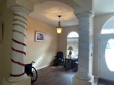 Decorated interior lobby with festive columns.