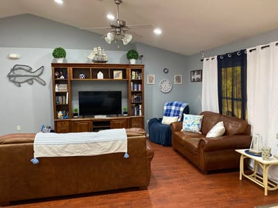 Cozy common area with seating and television.