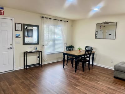 Bright common area with table and chairs