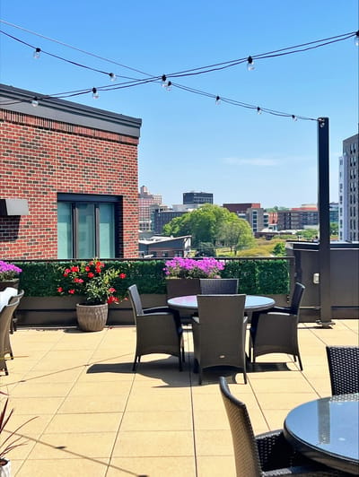 Outdoor terrace with seating and flowers