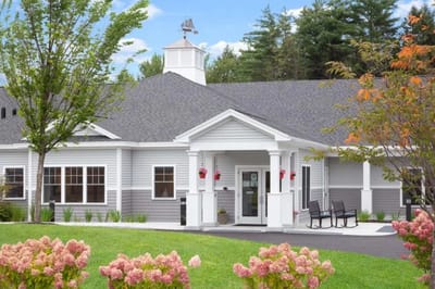 Exterior view of assisted living facility with flowers
