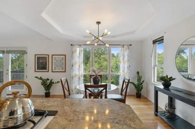 Bright, modern kitchen area with dining space.