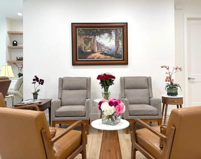 Common area with seating and floral decor.