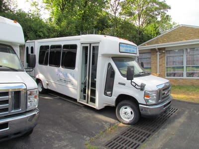 Magnolia Adult Day Care, assisted living in Fort Lee, NJ — Transportation shuttle parked at a senior living facility
