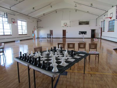 Magnolia Adult Day Care, assisted living in Fort Lee, NJ — Chess set arranged on a table in a gymnasium