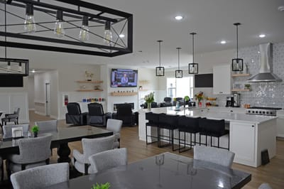 Modern common area with seating and kitchen space