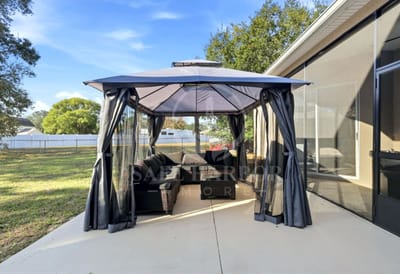 Outdoor seating area with a gazebo and lounge furniture