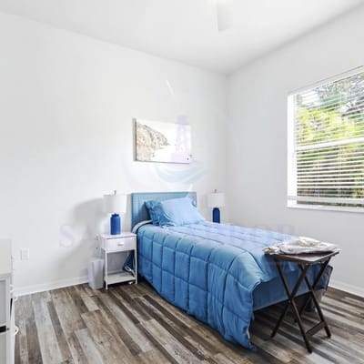Bright interior of a resident's room with blue decor