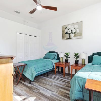 Cozy private room with twin beds and decor
