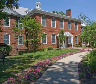 Exterior view of the facility with landscaped pathway