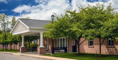 Entrance of Beaver Meadows assisted living facility with trees