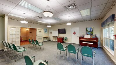 Activity room with chairs set up for a gathering