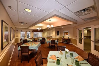Dining area with set tables and chairs