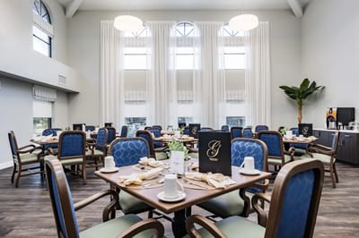 Dining room with elegantly set tables for residents
