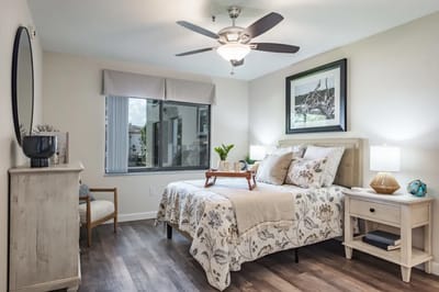 Cozy resident room with a bed and seating area