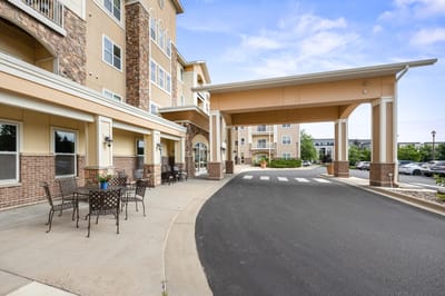 Exterior view of the facility entrance and outdoor seating area