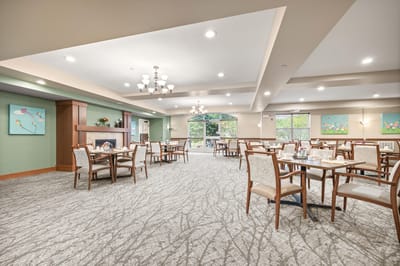 Dining room with tables set for residents