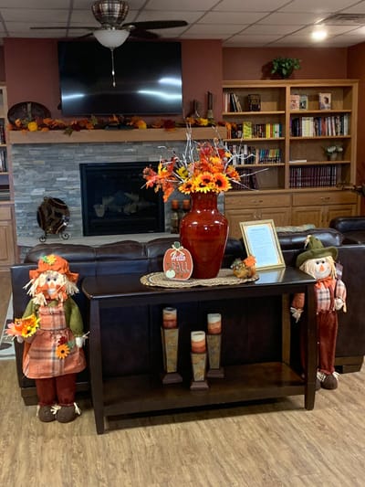 Cozy autumn-themed common area with decorations