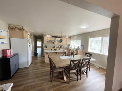 Bright kitchen with a dining table and appliances