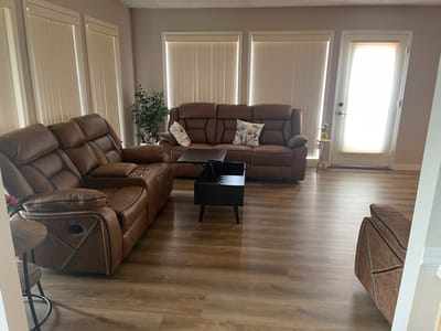 Cozy seating area with brown leather couches