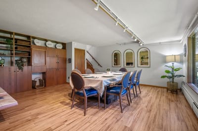 Cozy dining area with a wooden table and elegant chairs