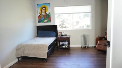 Cozy resident room with bed and window