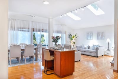Bright interior common area with seating and dining space