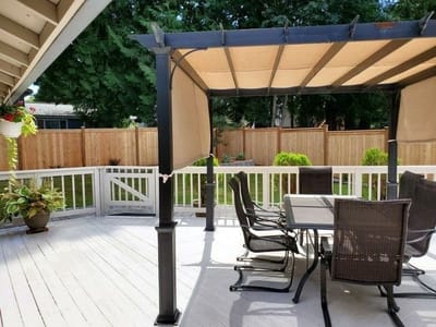 Outdoor patio area with seating and shade