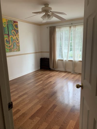 Interior view of a vacant room with hardwood floor