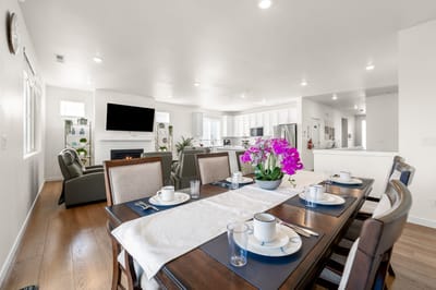 Bright dining area with a table set for meals