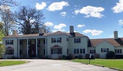 Exterior view of a senior living facility with landscaping