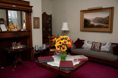 Cozy living room with flowers and artwork