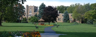 Exterior view of the assisted living facility with gardens