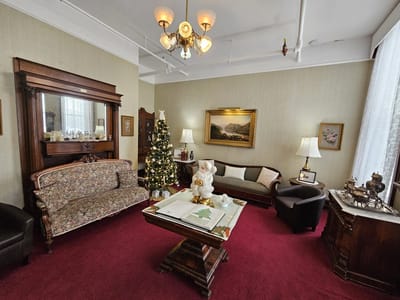 Cozy common area with festive decor and vintage furnishings