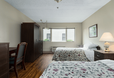 Private resident room with twin beds and furnishings