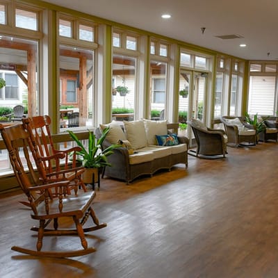 Bright common area with cozy seating and plants