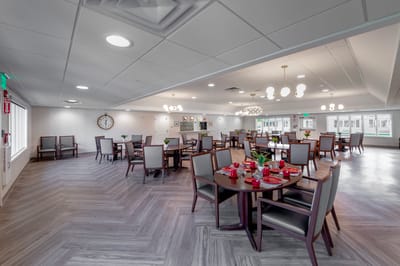 Bright dining room with tables set for meals