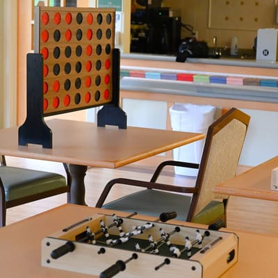 Interior game area with Connect 4 and foosball